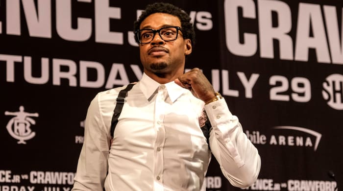 Errol Spence Jr. pumps his fist at a press conference ahead of his fight with Terence Crawford.